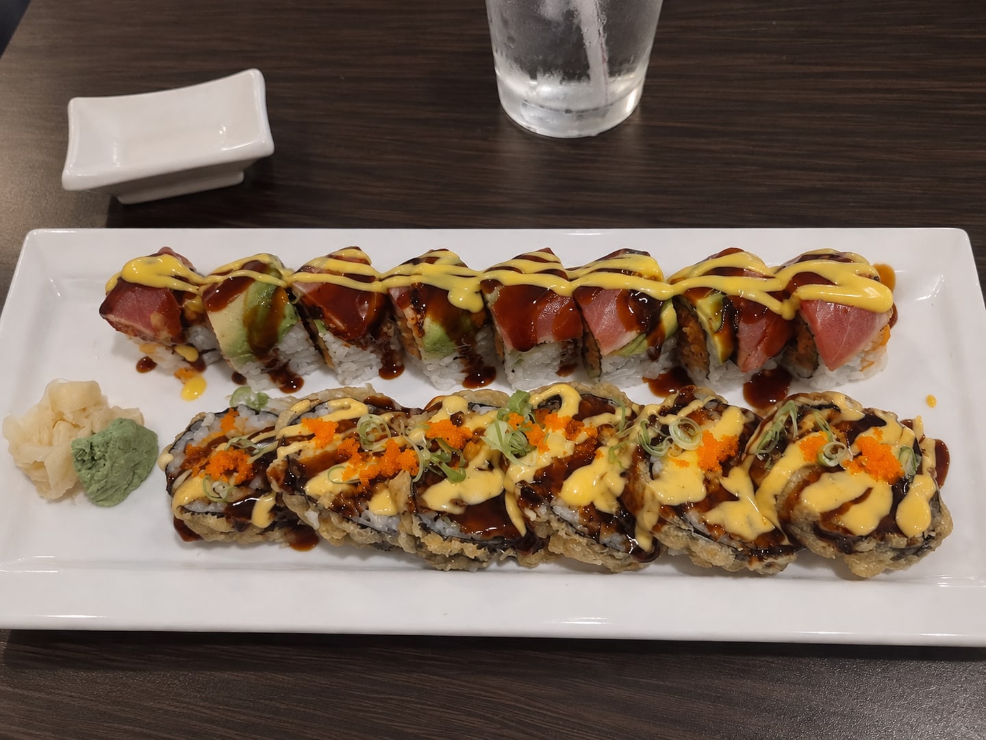 Two chef-prepared specialty rolls at Red Plum